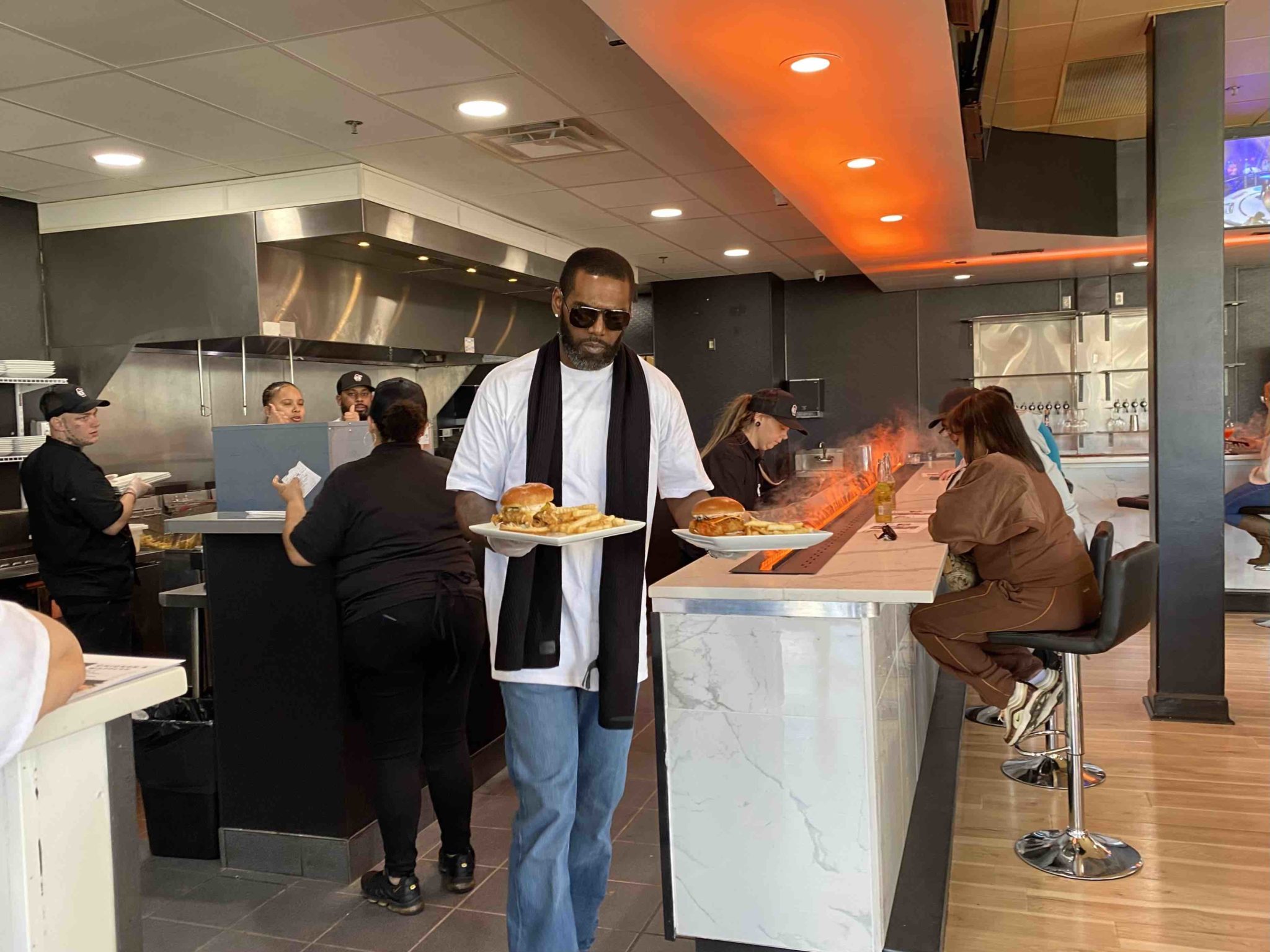 Randy Moss Personally Opens Crisppi’s Chicken In Downtown Huntington